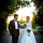 bride and groom standing on the street