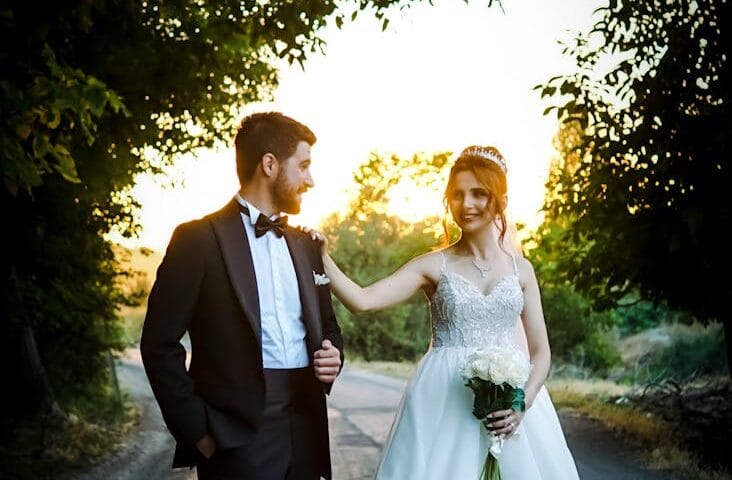 bride and groom standing on the street