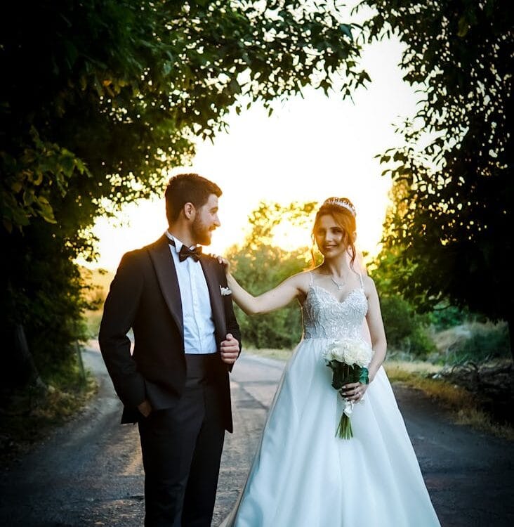 bride and groom standing on the street