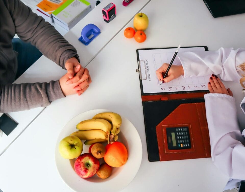 a doctor writing on a clipboard