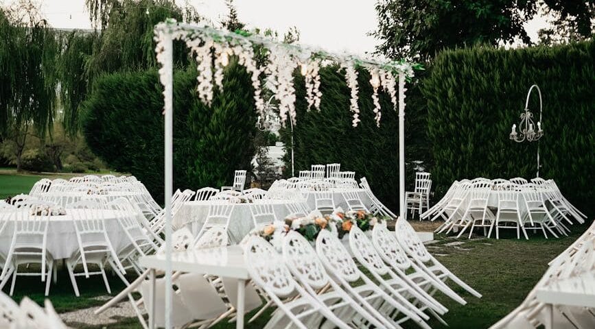 elegant outdoor wedding reception setup with white decor
