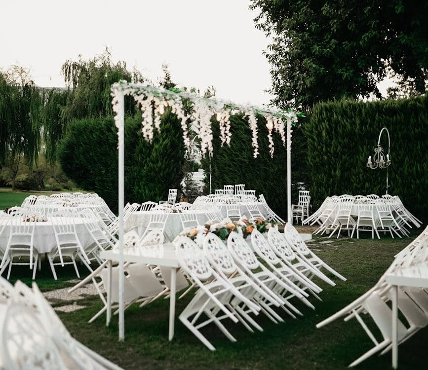 elegant outdoor wedding reception setup with white decor