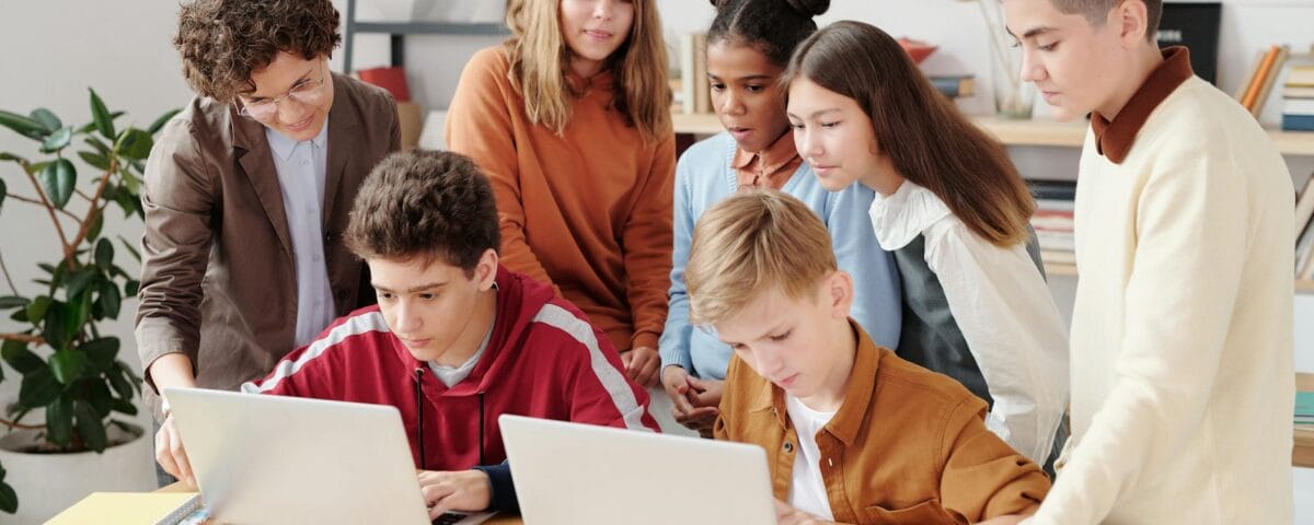a children looking the laptop