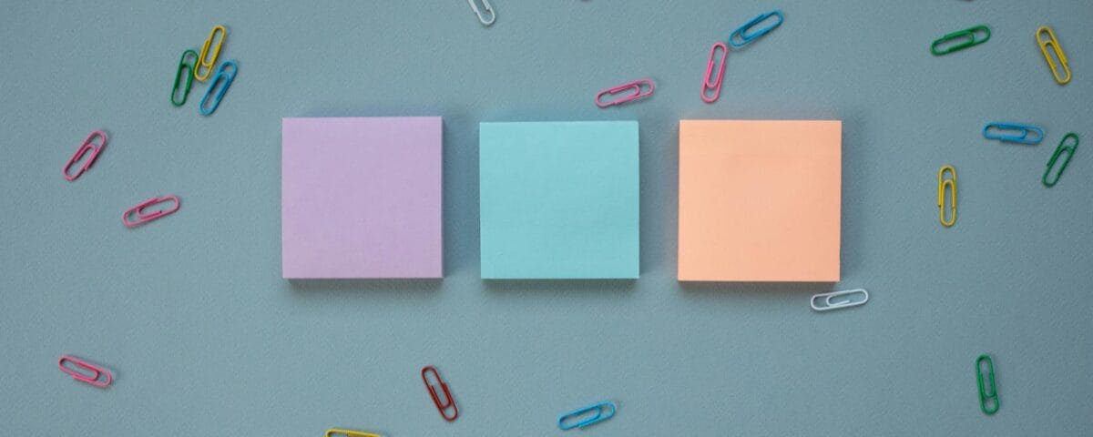 stacks of post it notes and paper clips
