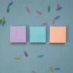 stacks of post it notes and paper clips