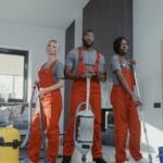 man in red polo shirt beside woman in blue polo shirt