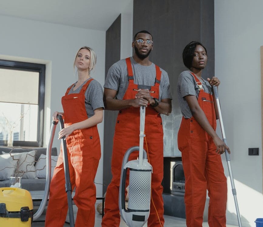 man in red polo shirt beside woman in blue polo shirt